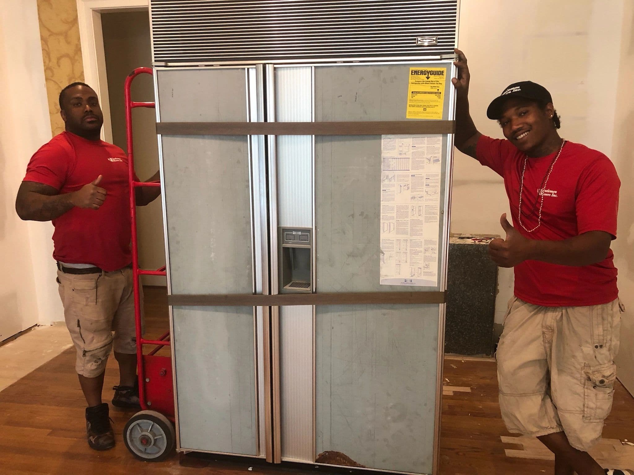 Gentlemen Movers team handling a move day setup